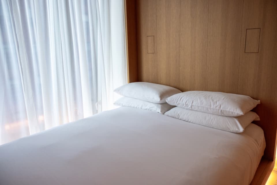 Freshly cleaned and sanitized white mattress in a bright bedroom